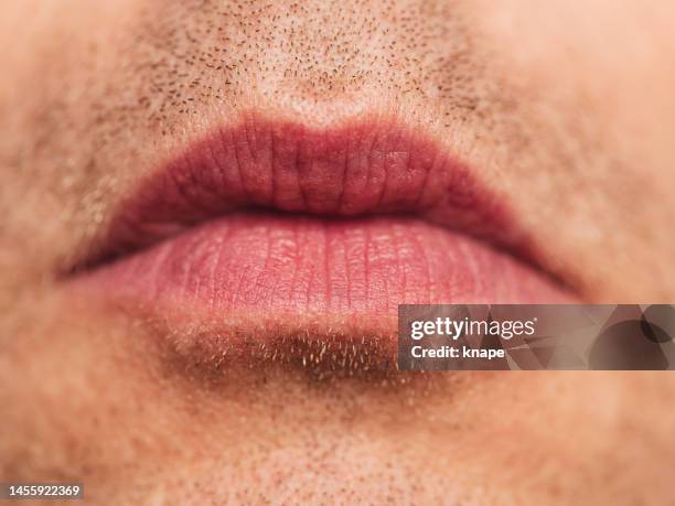 mouth - macro skin face detail with wrinkles on mature man - closed mouth stock pictures, royalty-free photos & images