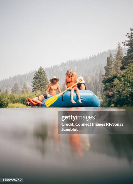 usa, california, family rafting on calm truckee river - rafting fotografías e imágenes de stock