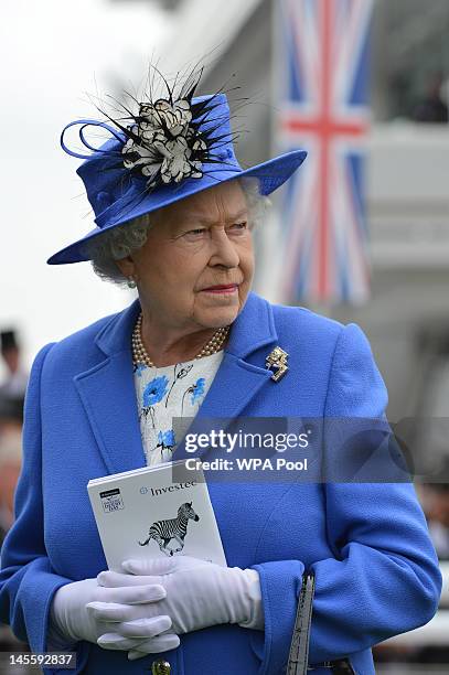 Queen Elizabeth II views the horses in the parade ring before the Diamond Jubilee Coronation Cup race on Derby Day on June 2, 2012 in Epsom, England....