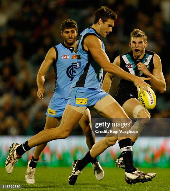 Shaun Hampson of Blues kicks the ball forward during the round 10 AFL match between the Port Adelaide Power and the Carlton Blues at AAMI Stadium on...