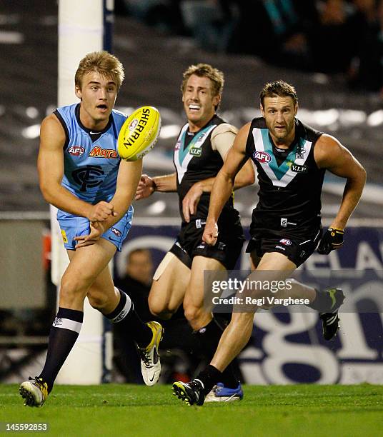 Matthew Watson of the Blues handpasses during the round 10 AFL match between the Port Adelaide Power and the Carlton Blues at AAMI Stadium on June 2,...