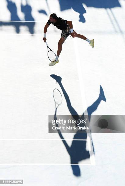 Thanasi Kokkinakis of Australia serves against Miomir Kecmanovic of Serbia during day four of the 2023 Adelaide International at Memorial Drive on...