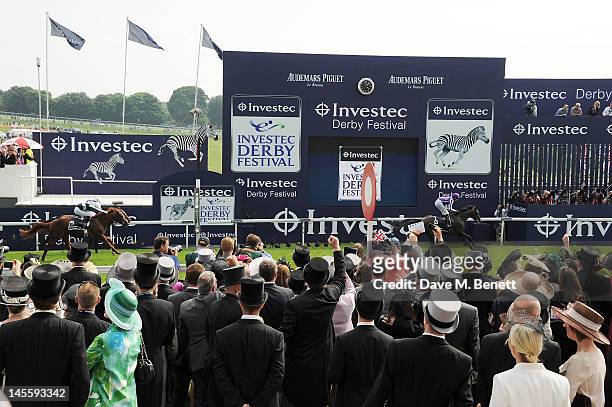 Jockey Jospeh O'Brien rides winning horse 'Camelot' across the finish line during the Investec Derby at Investec Derby Day at the Investec Derby...
