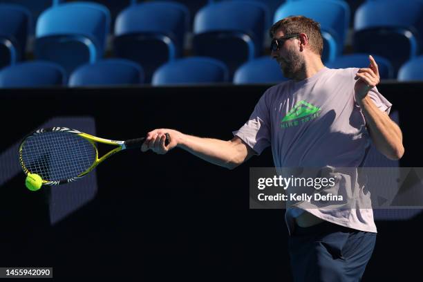 Dirk Nowitzki plays tennis against Alexander Zverev during a practice session ahead of the 2023 Australian Open at Melbourne Park on January 12, 2023...