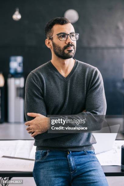 confident young latin businessman at the office - man looking away stock pictures, royalty-free photos & images