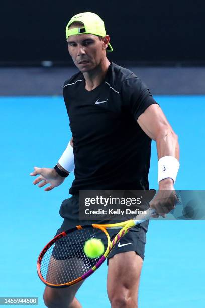 Rafael Nadal of Spain volleys during an open practice session ahead of the 2023 Australian Open at Melbourne Park on January 12, 2023 in Melbourne,...