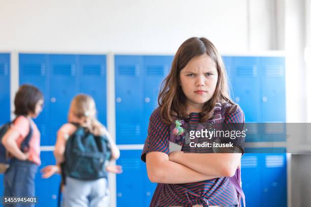 angry girl standing at school corrior - class argument stockfoto's en -beelden