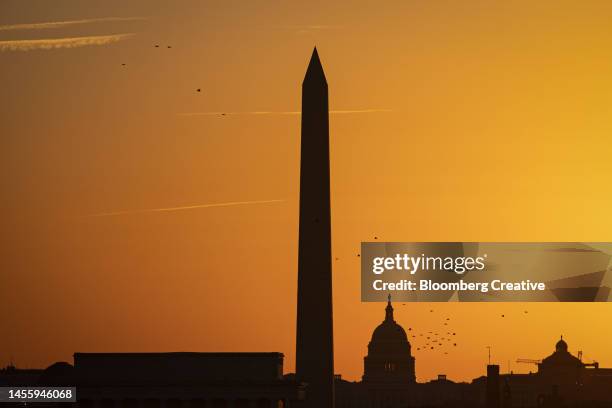 the washington monument and us capitol at sunrise - washington monument stock pictures, royalty-free photos & images