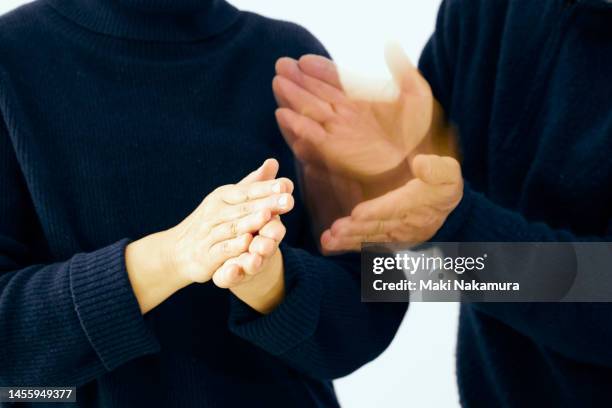 the will is expressed by the movement of the hands. - 調布 stockfoto's en -beelden