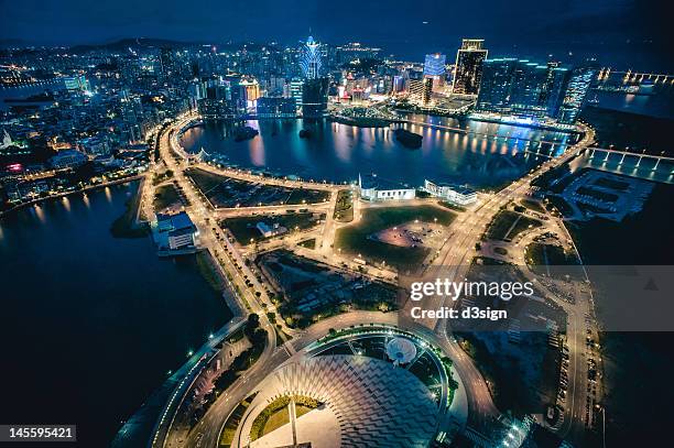 cityscape of macau at night - macao stock-fotos und bilder