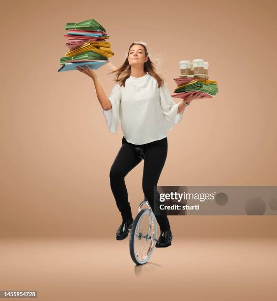 unicycling office junior - working office busy stockfoto's en -beelden