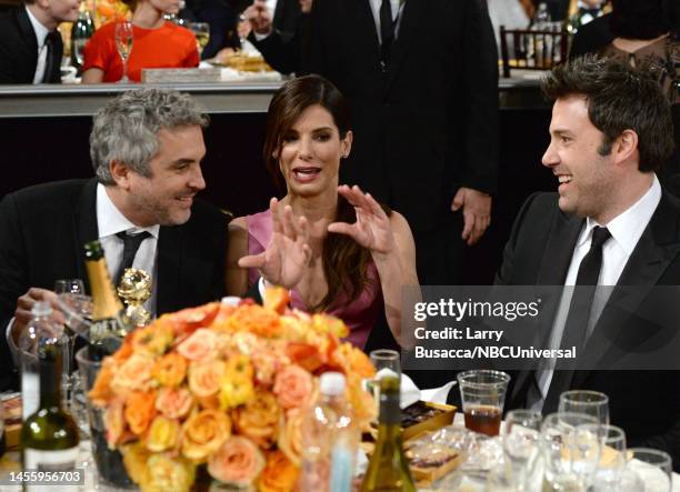 71st ANNUAL GOLDEN GLOBE AWARDS -- Pictured: Director Alfonso Cuarón and actors Sandra Bullock and Ben Affleck attend the 71st Annual Golden Globe...