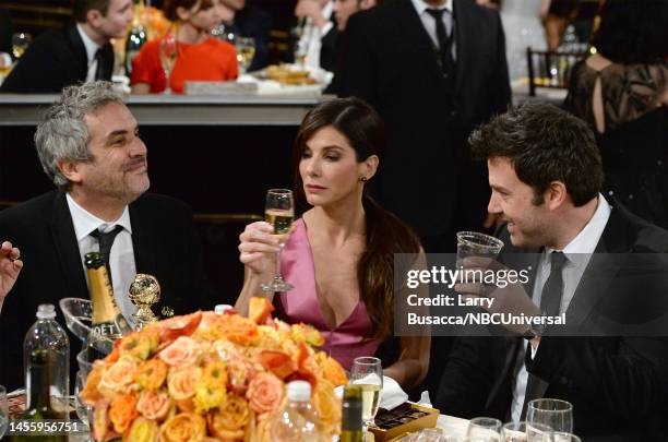 71st ANNUAL GOLDEN GLOBE AWARDS -- Pictured: Director Alfonso Cuaron and actors Sandra Bullock and Ben Affleck at the 71st Annual Golden Globe Awards...