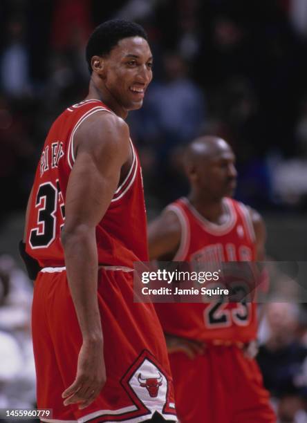 Scottie Pippen, Small Forward for the Chicago Bulls and team mate Michael Jordan look on during the NBA Atlantic Division basketball game against the...