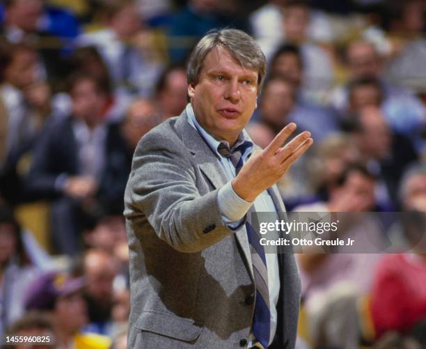 Don Nelson, Head Coach for the Milwaukee Bucks gives out hand sign instructions to his players during the NBA Pacific Division basketball game...