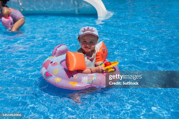 fun in the swimming pool - kids swim caps stock pictures, royalty-free photos & images