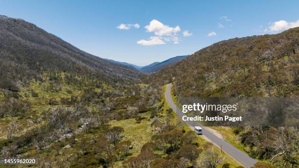 motorhome parked up on the road (alpine way) next to the thredbo river in the snowy mountains - camping new south wales stock pictures, royalty-free photos & images