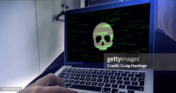 laptop technology suffering cyber attack hacker ransomware event - pirate criminal fotografías e imágenes de stock