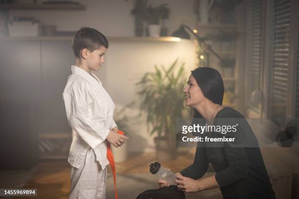 getting ready for training - karateka stock pictures, royalty-free photos & images