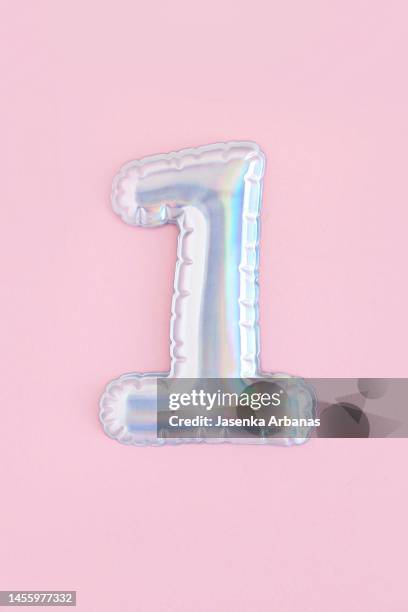 helium balloon number 1 - metallic balloons stock pictures, royalty-free photos & images