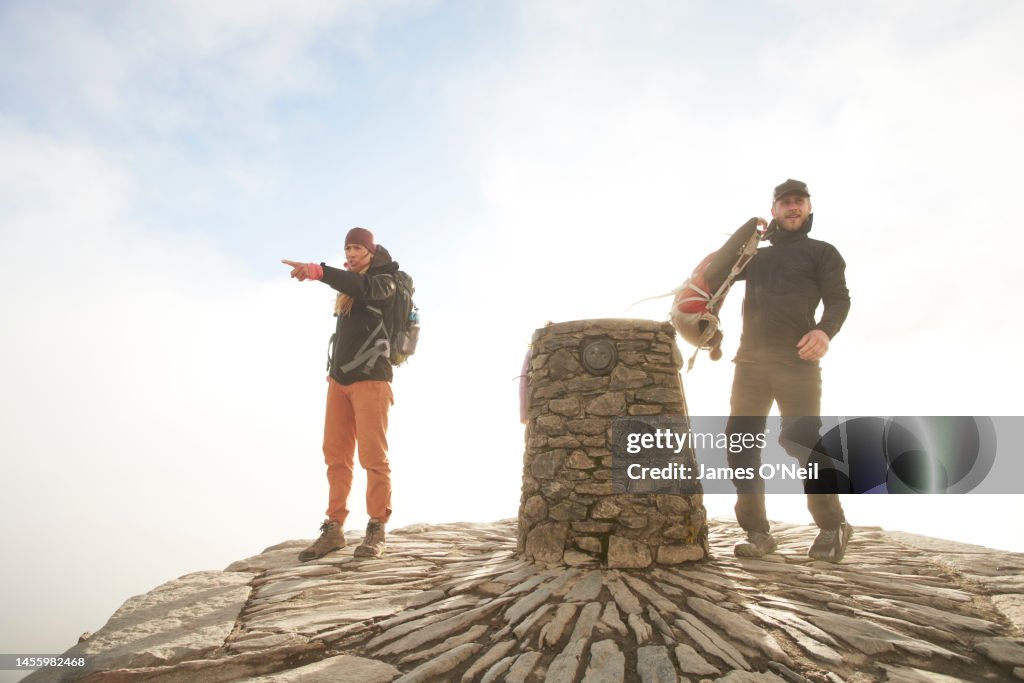 Couple on top of mountain summit