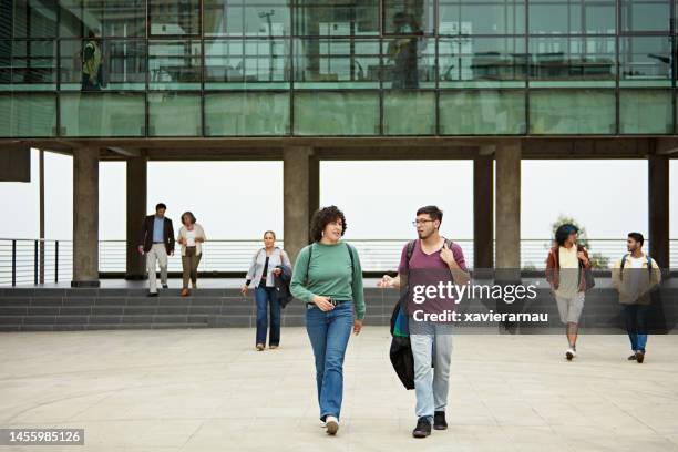 students and educators on modern college campus - man talking to camera stock pictures, royalty-free photos & images