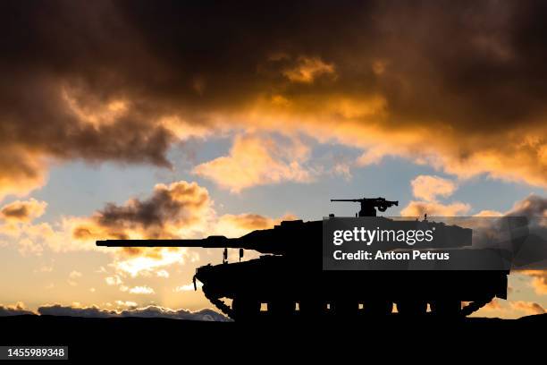 german main battle tank on the background of the sunset sky - war in ukraine stock pictures, royalty-free photos & images