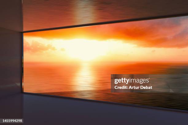 big window view to the ocean with dramatic golden light sunset. - home golden hour stock pictures, royalty-free photos & images