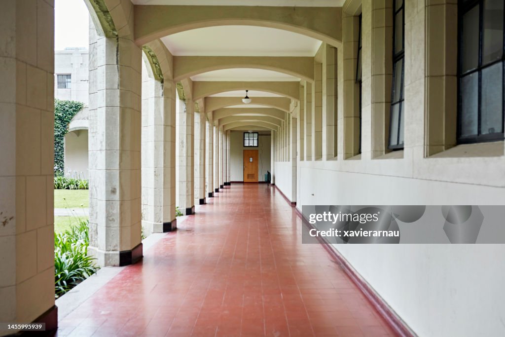 Unoccupied colonnade outside university building
