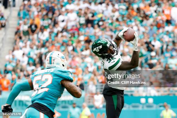 Running back Michael Carter of the New York Jets during their game against the Miami Dolphins at Hard Rock Stadium on January 08, 2023 in Miami...