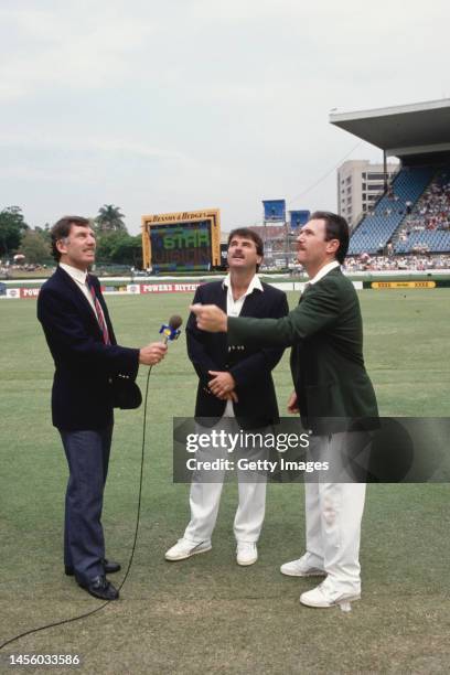 England captain Allan Lamb with Australia captain Allan Border at the coin toss with Television commentator Ian Chappell before the 1st Test Match...