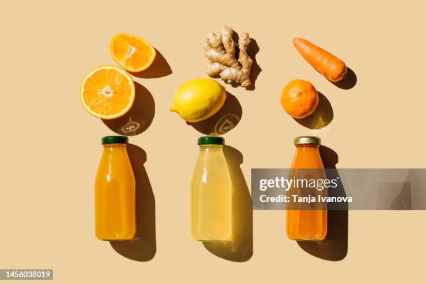 various of colorful smoothies or juices bottles beverages drinks with various fresh ingredients: fruits and vegetables on beige background. superfoods, healthy food, drinks, diet and detox concept. flat lay, top view - blended drink ストックフォトと画像