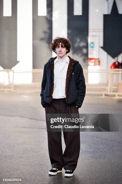 Guest, wearing brown pants, white shirt and black jacket, is seen at Fortezza Da Basso on January 12, 2023 in Florence, Italy.