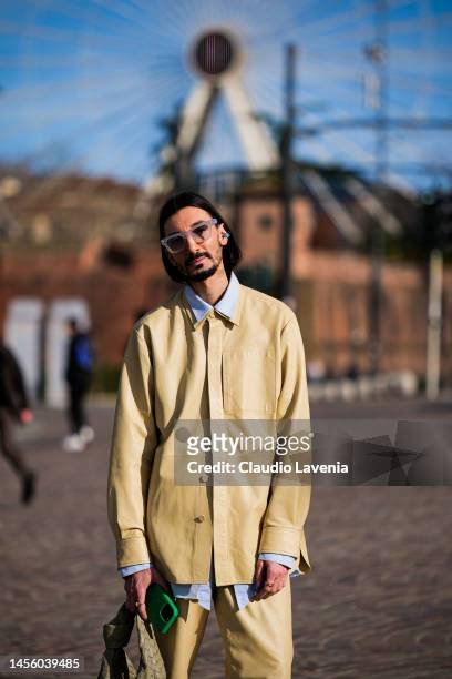 Julian Daynov, wearing a yellow leather jacket and pants, green Bottega Veneta handbag and Fendi shoes, is seen at Fortezza Da Basso on January 12,...