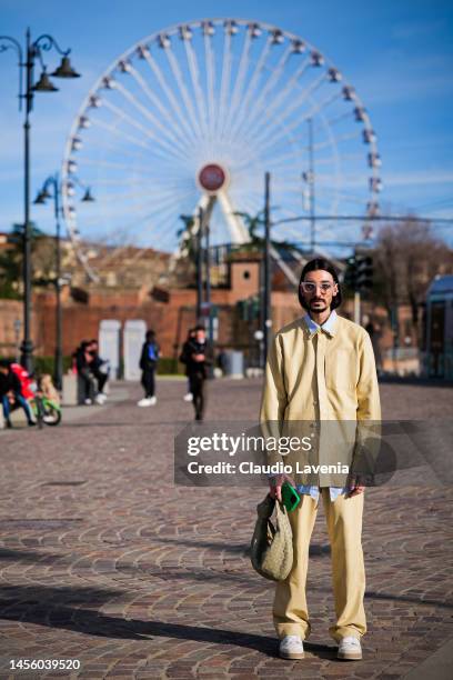 Julian Daynov, wearing a yellow leather jacket and pants, green Bottega Veneta handbag and Fendi shoes, is seen at Fortezza Da Basso on January 12,...