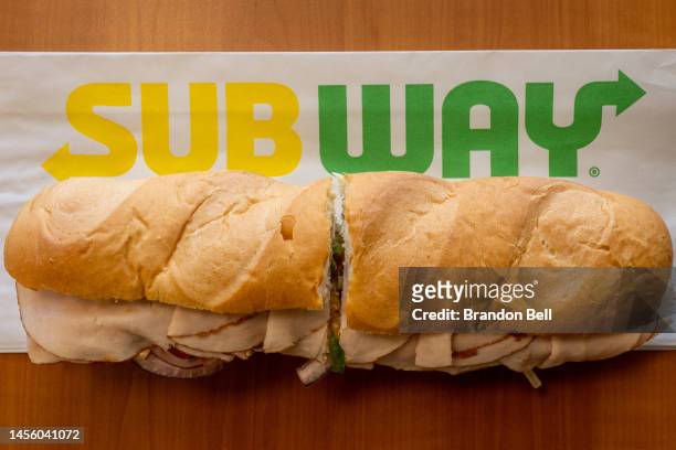 In this photo illustration, a Subway sandwich is seen on a table at a Subway restaurant on January 12, 2023 in Austin, Texas. Subway has reportedly...