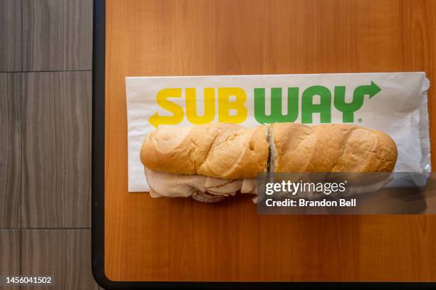 In this photo illustration, a Subway sandwich is seen on a table at a Subway restaurant on January 12, 2023 in Austin, Texas. Subway has reportedly...