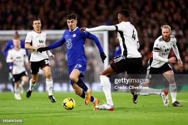 Kai Havertz of Chelsea battles for possession with Tosin Adarabioyo of Fulham during the Premier League match between Fulham FC and Chelsea FC at...