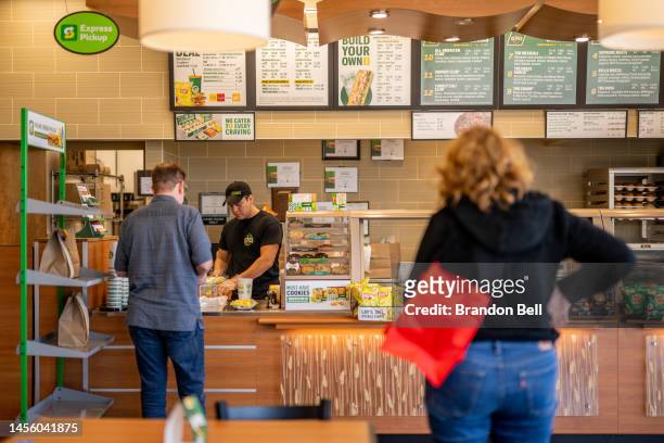 Customers wait in line at a Subway restaurant on January 12, 2023 in Austin, Texas. Subway has reportedly begun exploring a sale which could value...