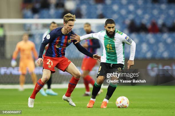 Nabil Fekir of Real Betis battles for possession with Frenkie de Jong of FC Barcelona during the Super Copa de España semi-final match between Real...