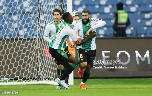 Nabil Fekir of Real Betis celebrates with teammates after scoring the team's first goal during the Super Copa de España semi-final match between Real...
