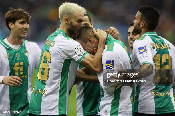 Loren Moron of Real Betis celebrates with teammates after scoring the team's second goal during the Super Copa de España semi-final match between...