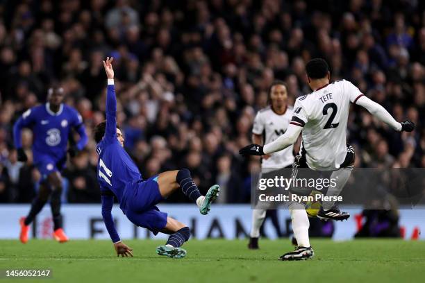 Joao Felix of Chelsea tackles Kenny Tete of Fulham which results in a red card during the Premier League match between Fulham FC and Chelsea FC at...