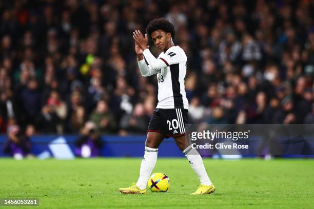 Willian of Fulham applauds the fans as he is substituted off during the Premier League match between Fulham FC and Chelsea FC at Craven Cottage on...
