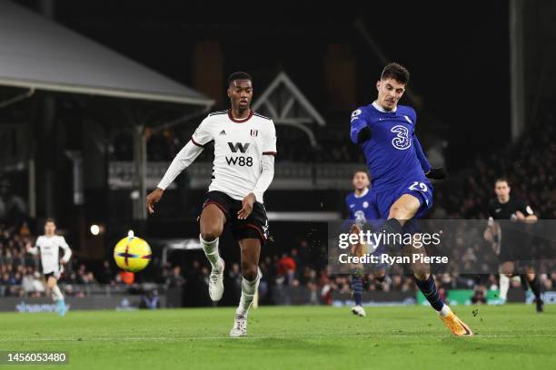 Kai Havertz of Chelsea shoots under pressure from Tosin Adarabioyo of Fulham during the Premier League match between Fulham FC and Chelsea FC at...