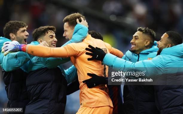 Marc-Andre ter Stegen of FC Barcelona and teammates celebrate following the team's victory in the penalty shoot out during the Super Copa de España...