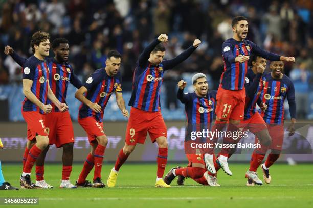 Players of FC Barcelona celebrate following the team's victory in the penalty shoot out during the Super Copa de España semi-final match between Real...