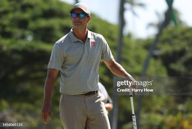 Adam Scott of Australia reacts to a missed birdie putt on the third green during the first round of the Sony Open in Hawaii at Waialae Country Club...