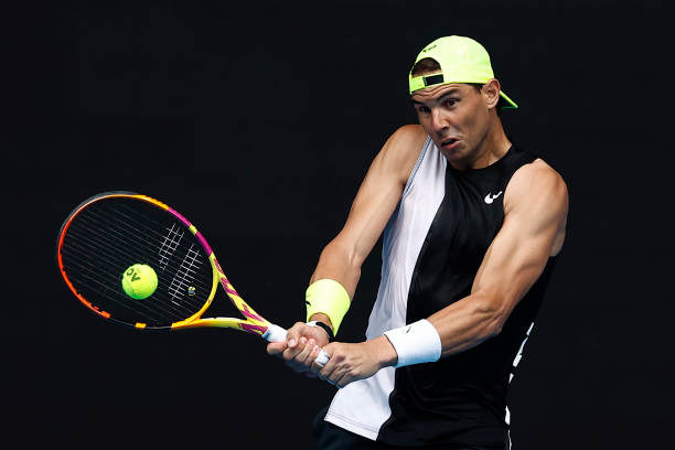 Rafael Nadal of Spain plays a backhand shot during a practice session ahead of the 2023 Australian Open at Melbourne Park on January 13, 2023 in...
