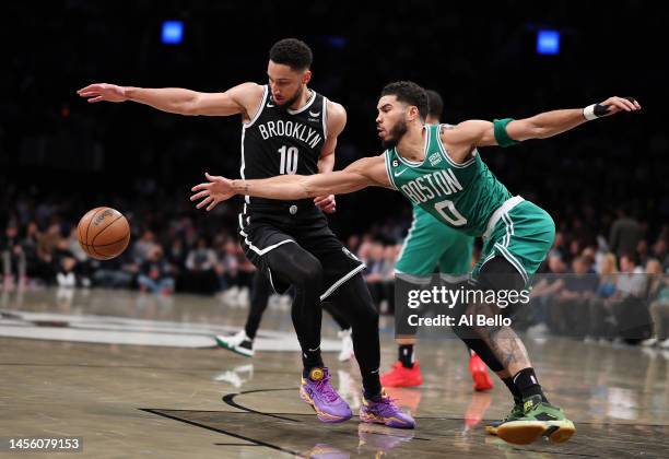 Ben Simmons of the Brooklyn Nets and Jayson Tatum of the Boston Celtics battle for the ball during their game at Barclays Center on January 12, 2023...